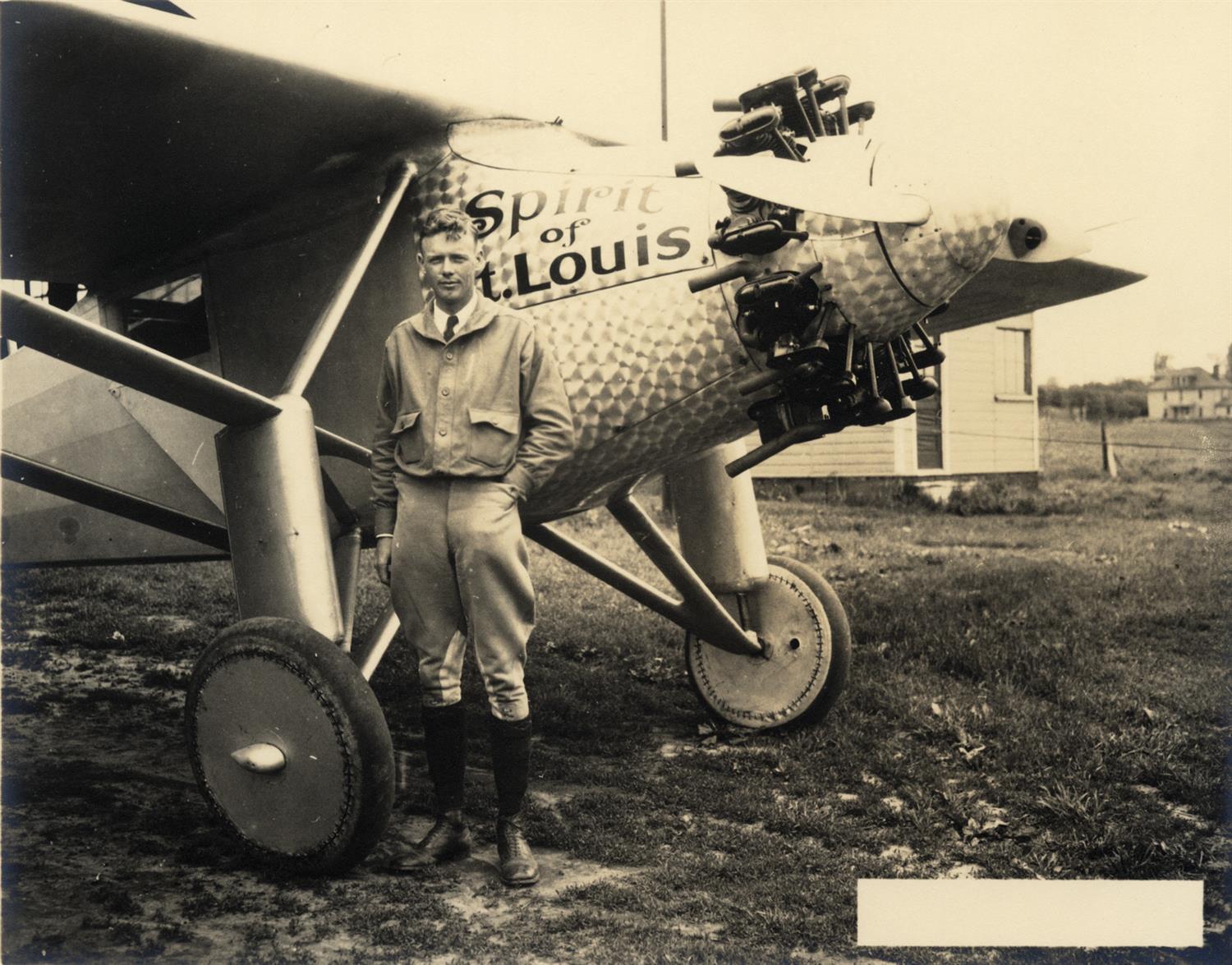 Charles Lindbergh next to The Spirit of St. Louis